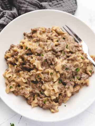 White plate with Instant Pot ground beef stroganoff on it.