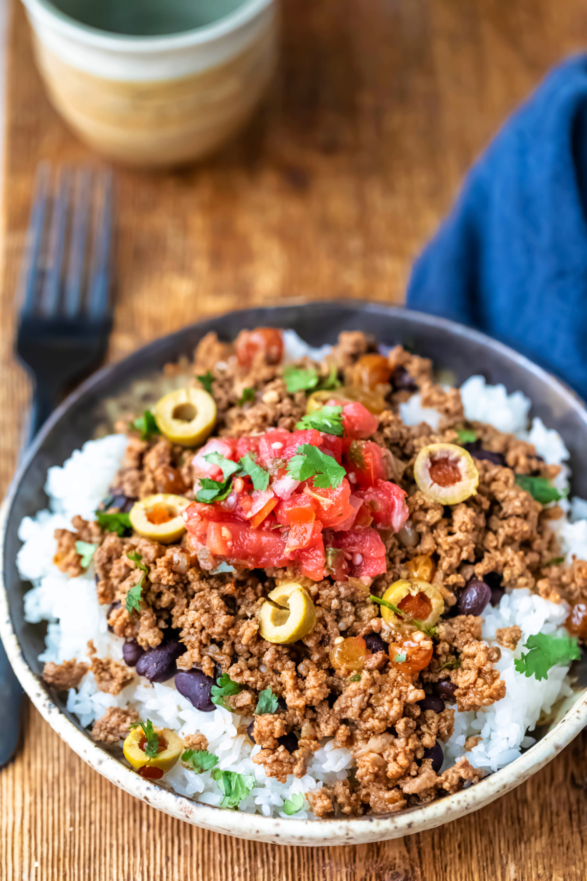 Plate of beef picadillo over rice. 