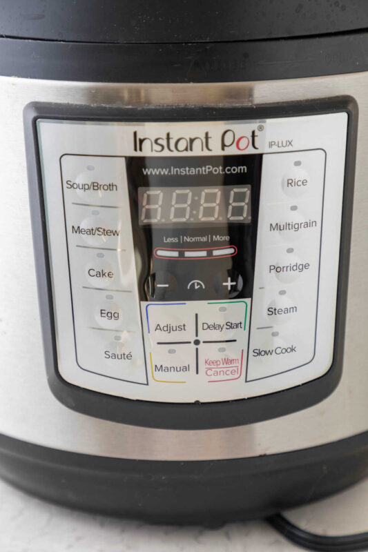 Close up photo of instant pot buttons.