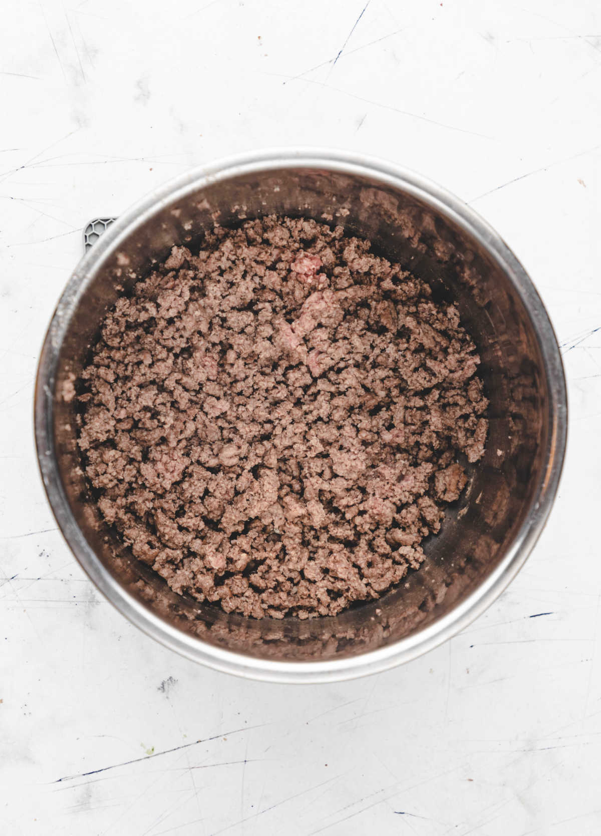 Browned ground beef in an Instant Pot.
