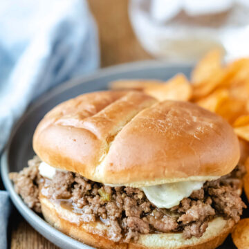 Philly cheesesteak sloppy joe topped with melted cheese.