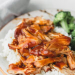 Honey bourbon chicken on a bed of rice.