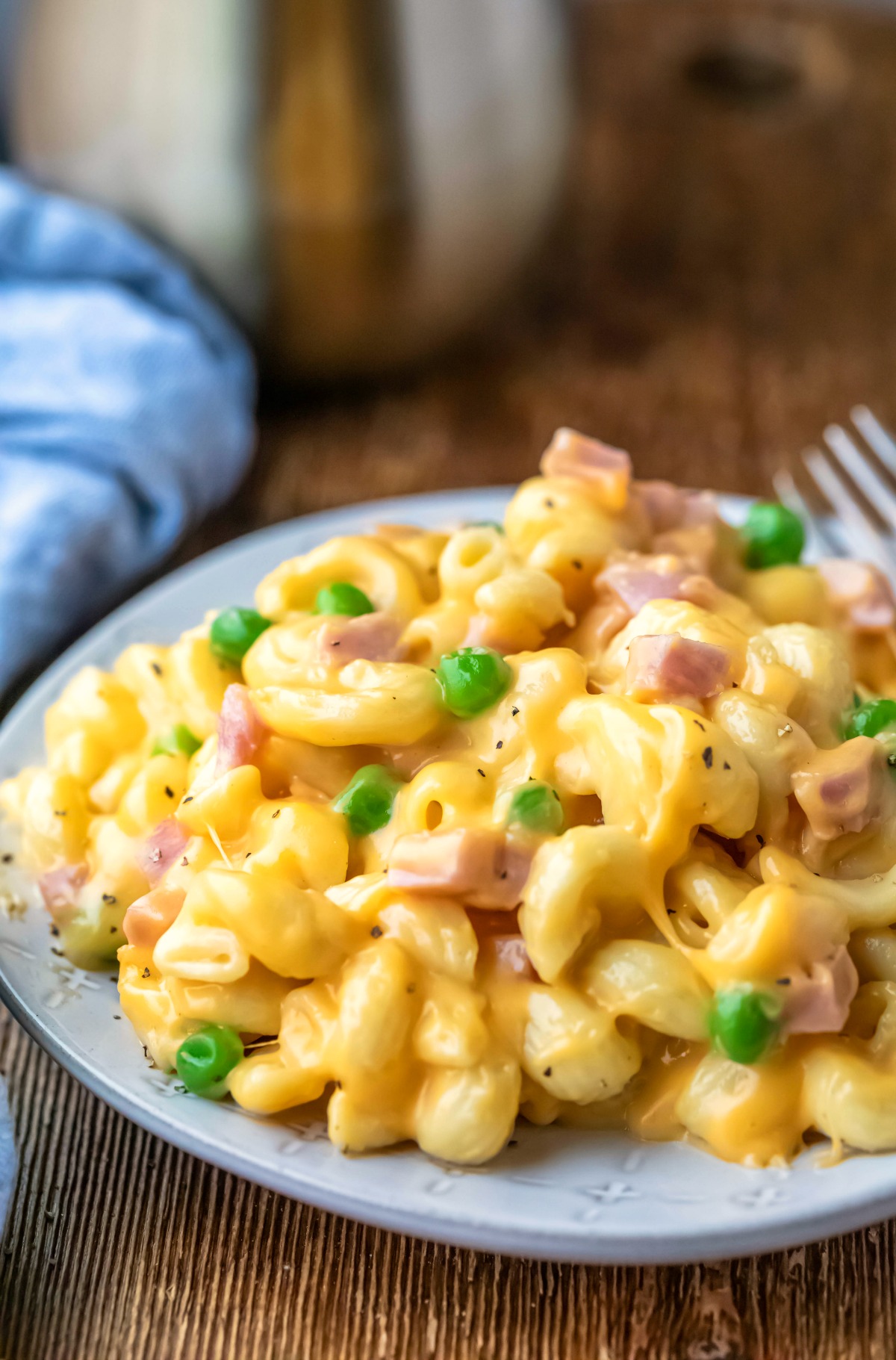 Plate of Instant Pot macaroni and cheese with ham and peas.