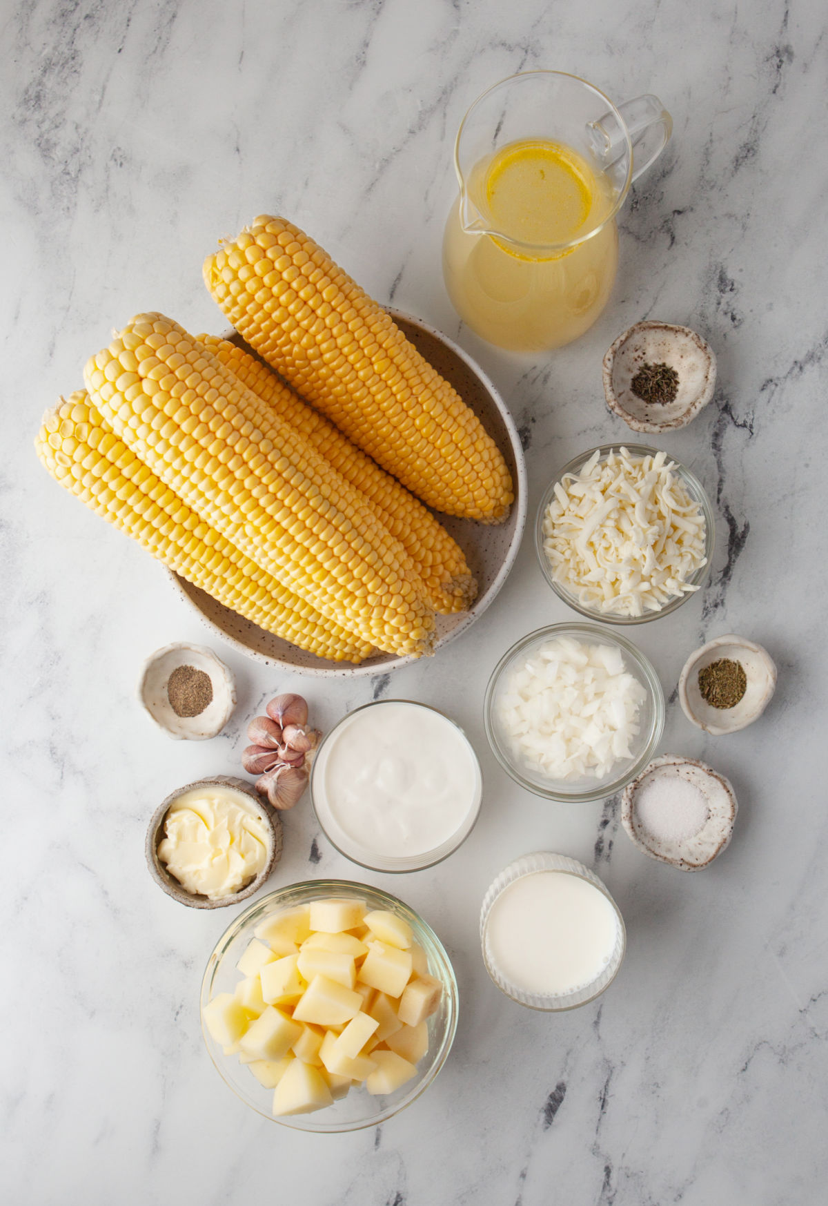Ingredients for instant pot potato corn chowder in dishes. 