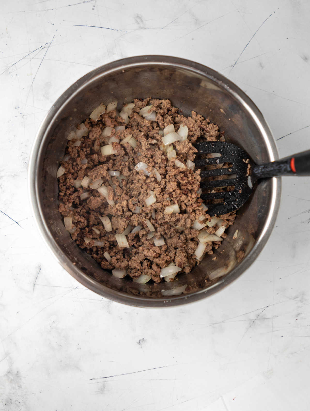 Ground beef browning in an instant pot. 