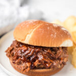 Instant Pot barbecue beef sandwich on a white plate.