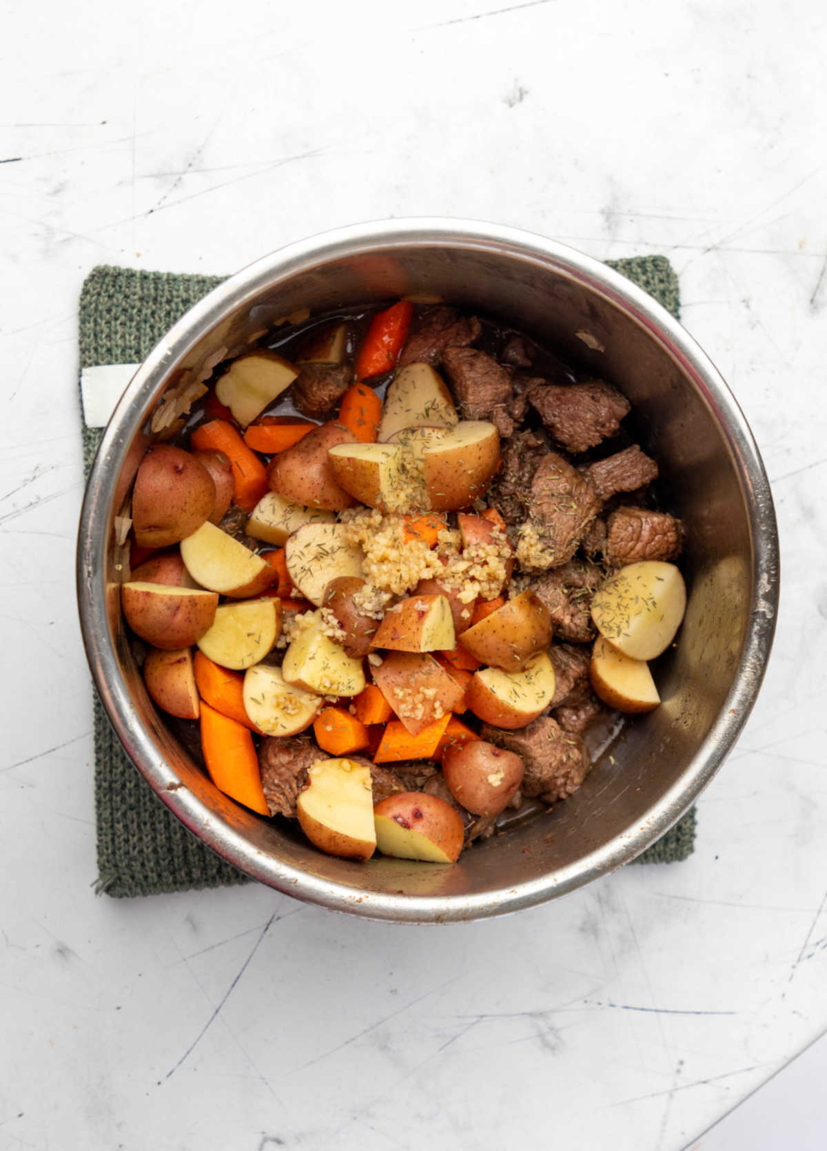 Ingredients for instant pot beef stew in an instant pot. 