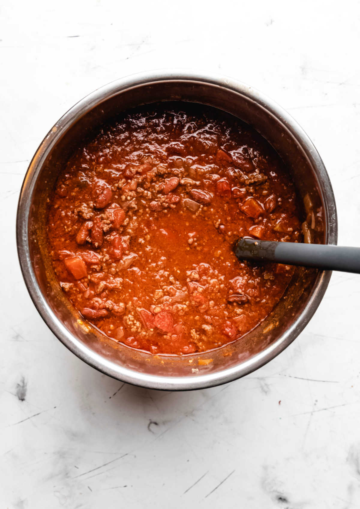 Ground beef chili in an instant pot inner pot. 