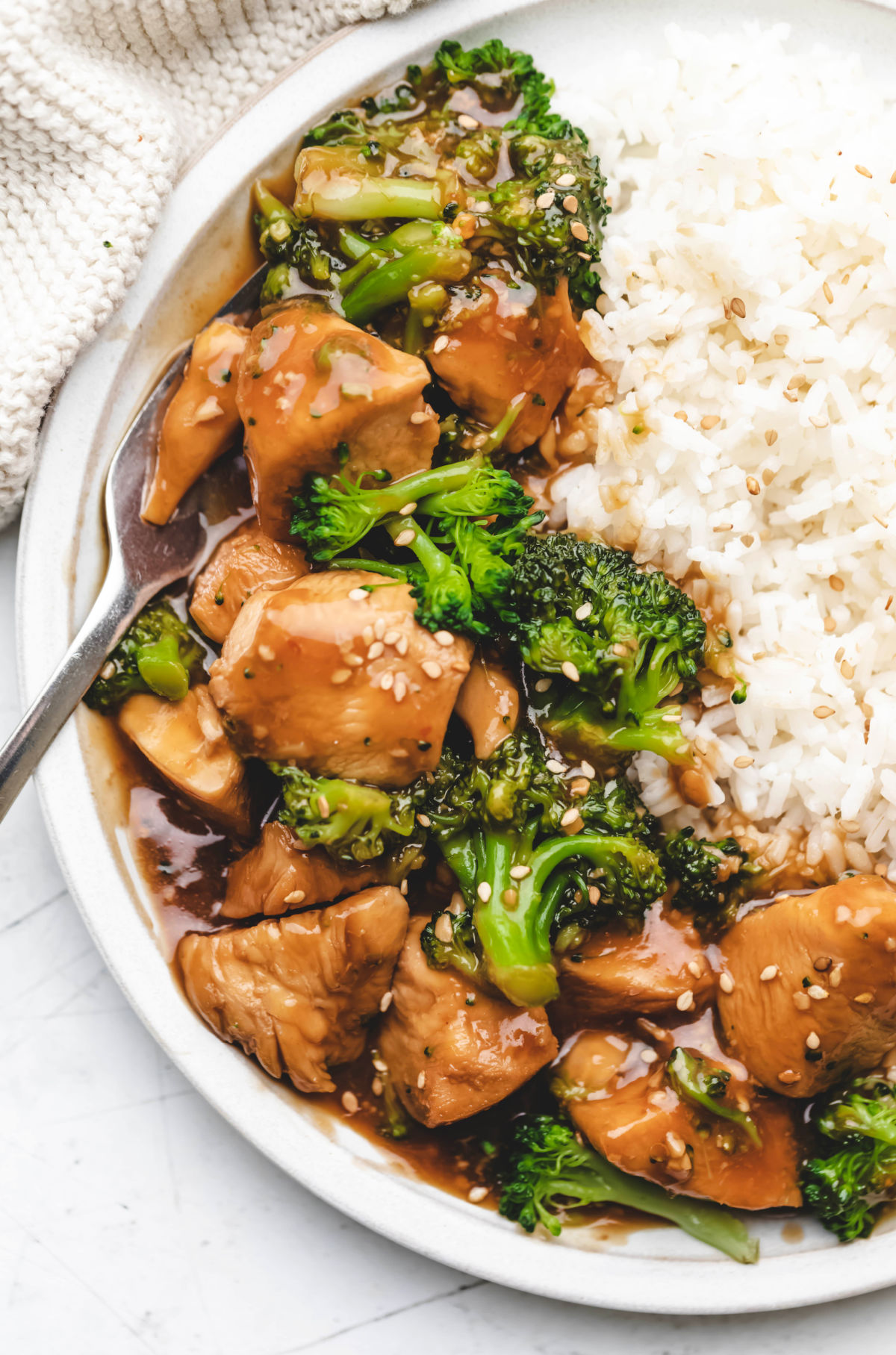 Close up photo of Instant Pot chicken and broccoli on white rice. 