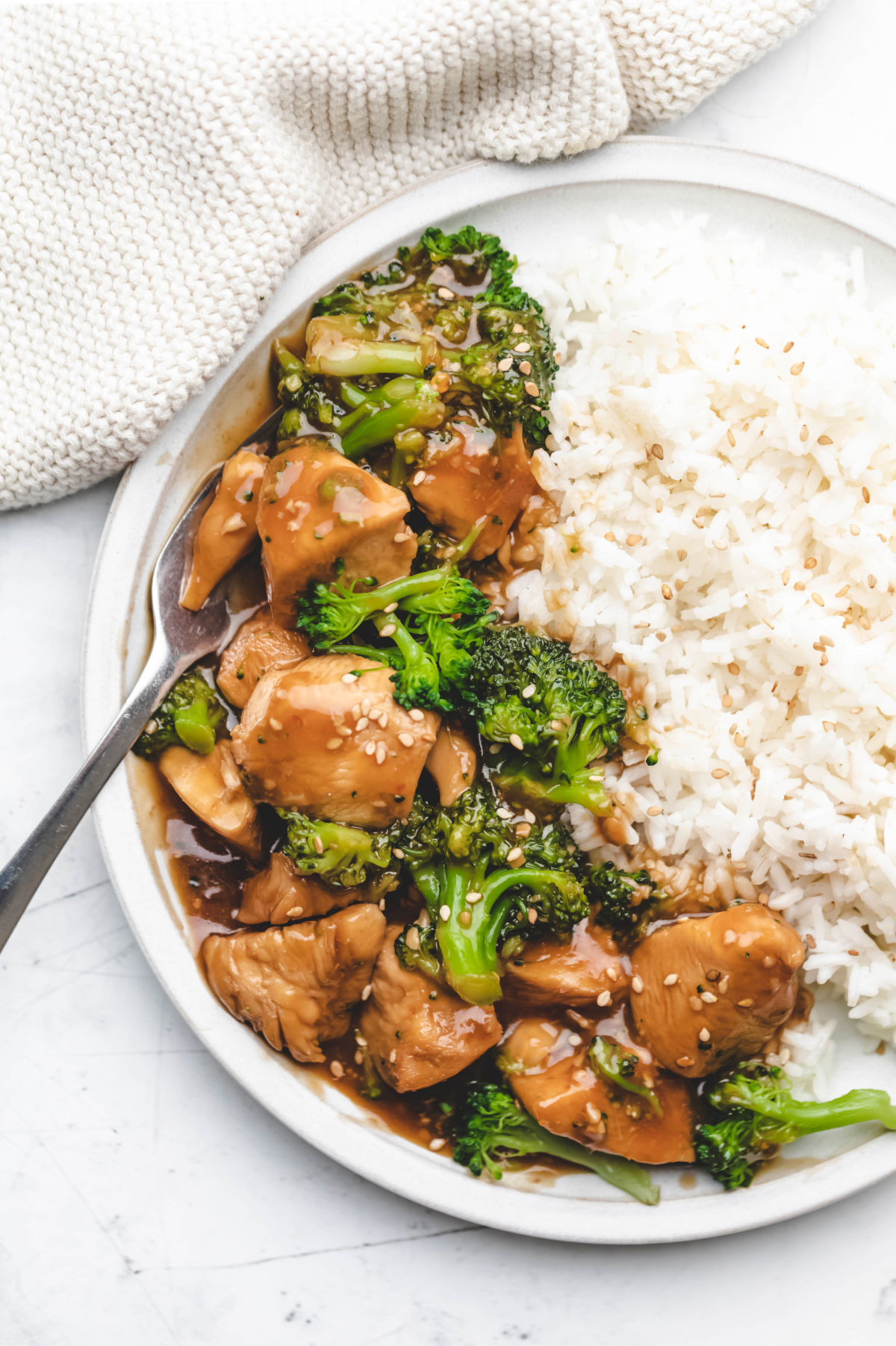 Instant Pot chicken and broccoli on a white plate. 