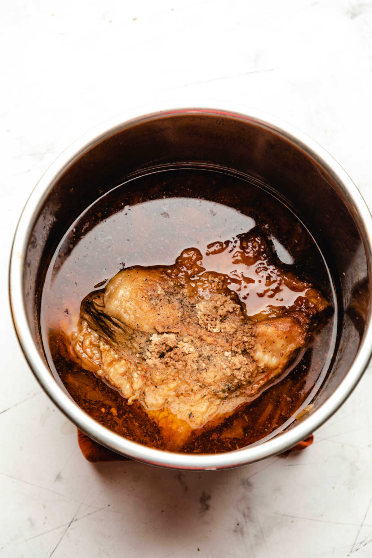 Brisket in cooking liquid in an instant pot. 