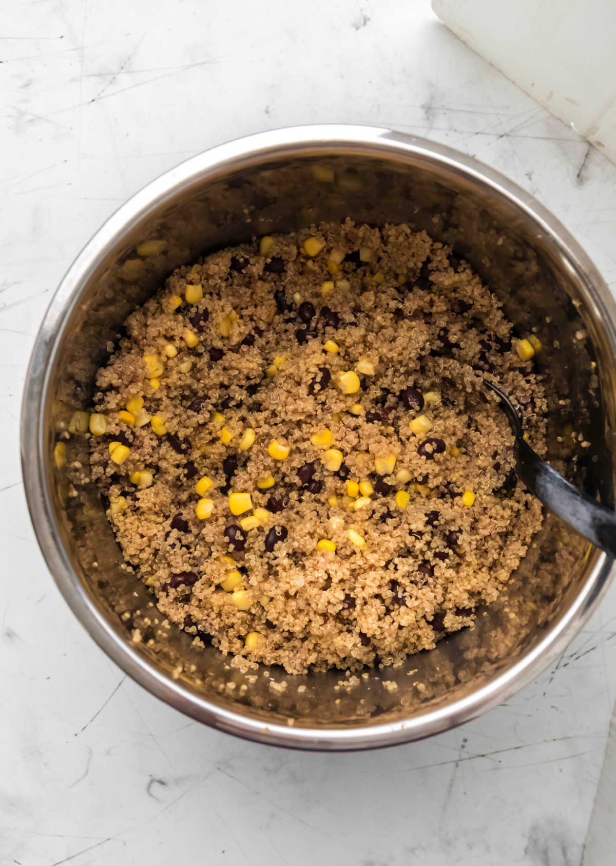 Cooked quinoa with black beans and corn in an instant pot.