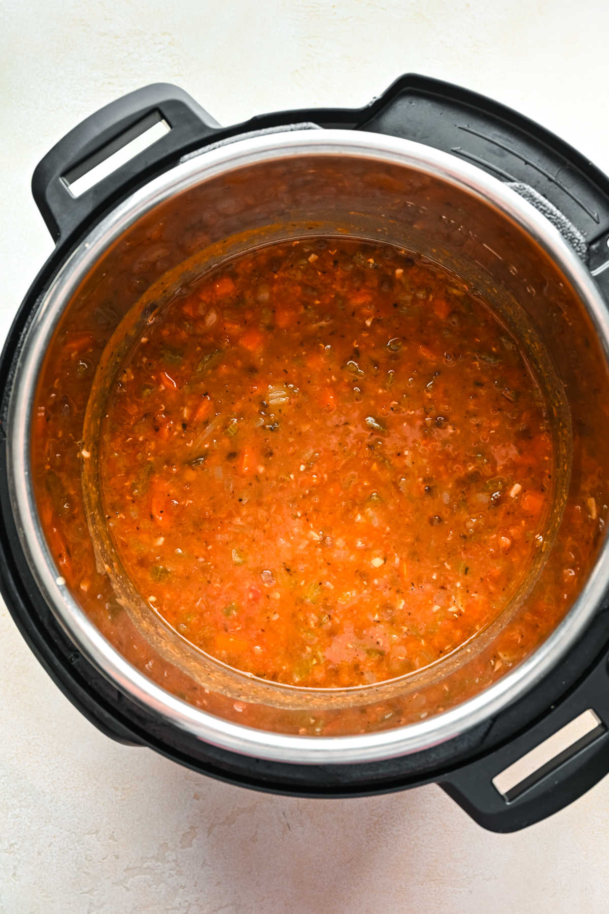 Stirred lentil soup in an Instant Pot. 