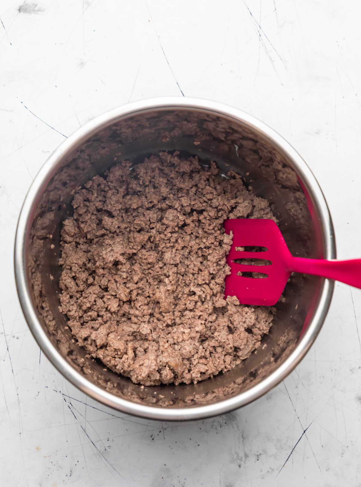 Browned ground beef in an Instant Pot.