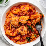 A plate of Instant Pot tortellini topped with grated parmesan.