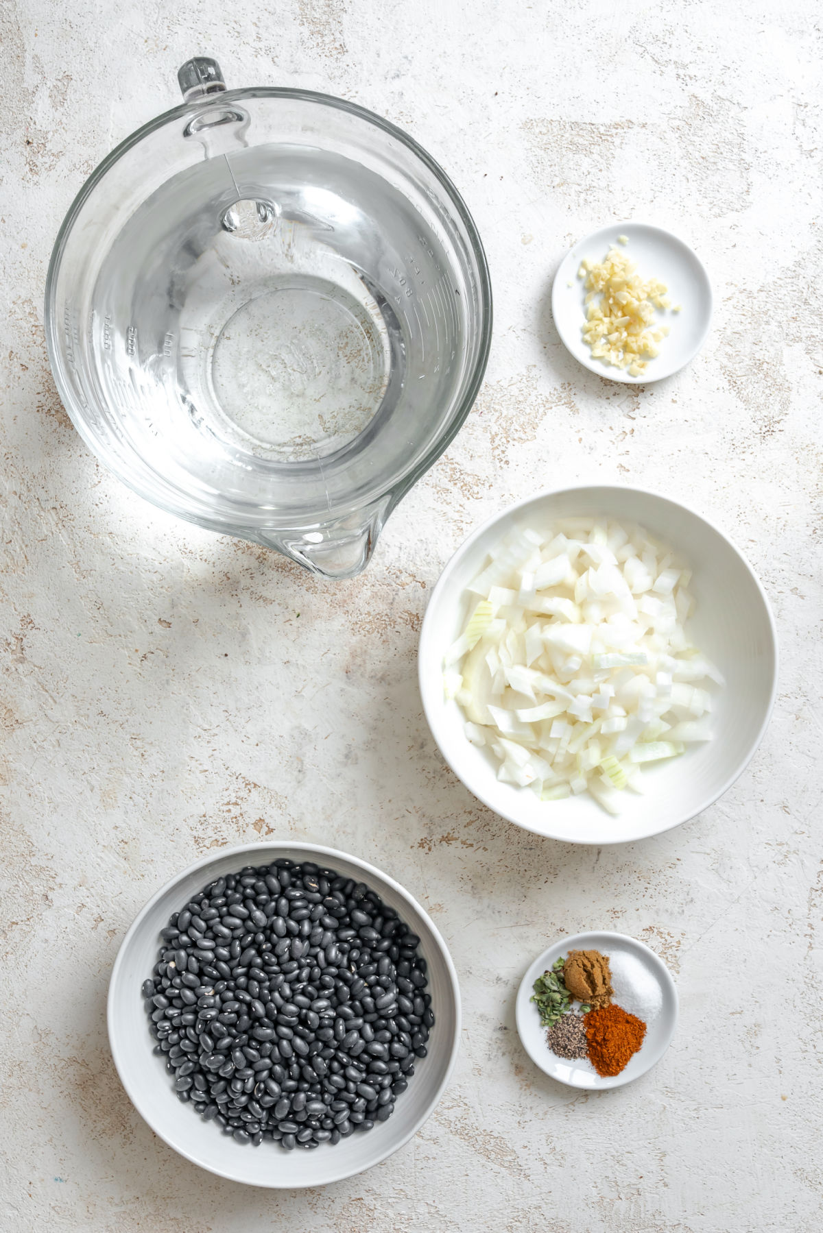 Ingredients for Instant Pot black beans in dishes.